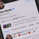 A photo illustration featuring Elon Musk's tweet announcing that he will buy Twitter.